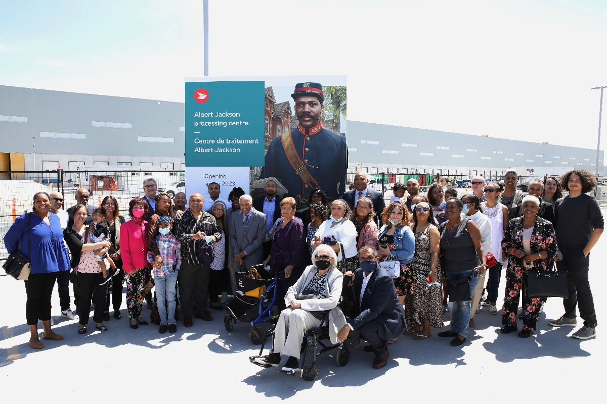 Canada Post, local officials and Jackson family members present the Albert Jackson parcel centre