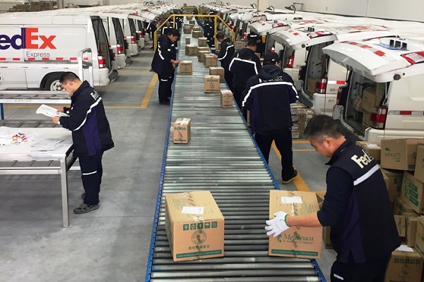 FedEx China workers sort deliveries